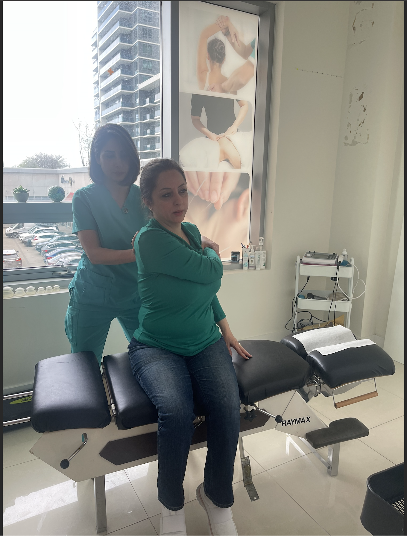 Patient performing rehab exercise with practitioner support