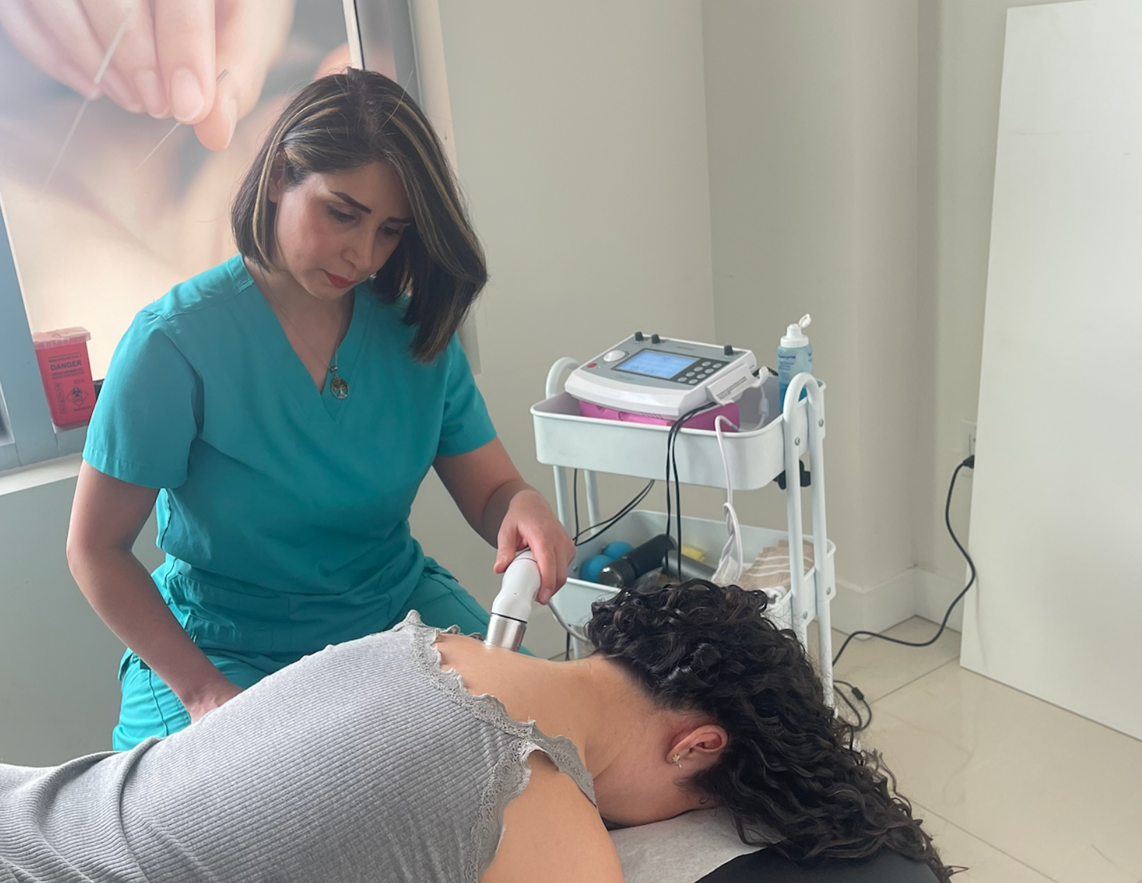 Practitioner working with a patient during a treatment session at RehabOne Plus in Thornhill